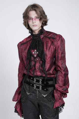 Man wearing a red satin jacquard ruffle shirt with black lace jabot.