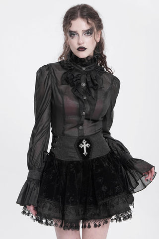 Model wearing Devil Fashion SKT23001 Baroness Bloodrose Mini Skirt in black jacquard and velvet with jeweled cross detail, styled with a sheer ruffled Gothic blouse.