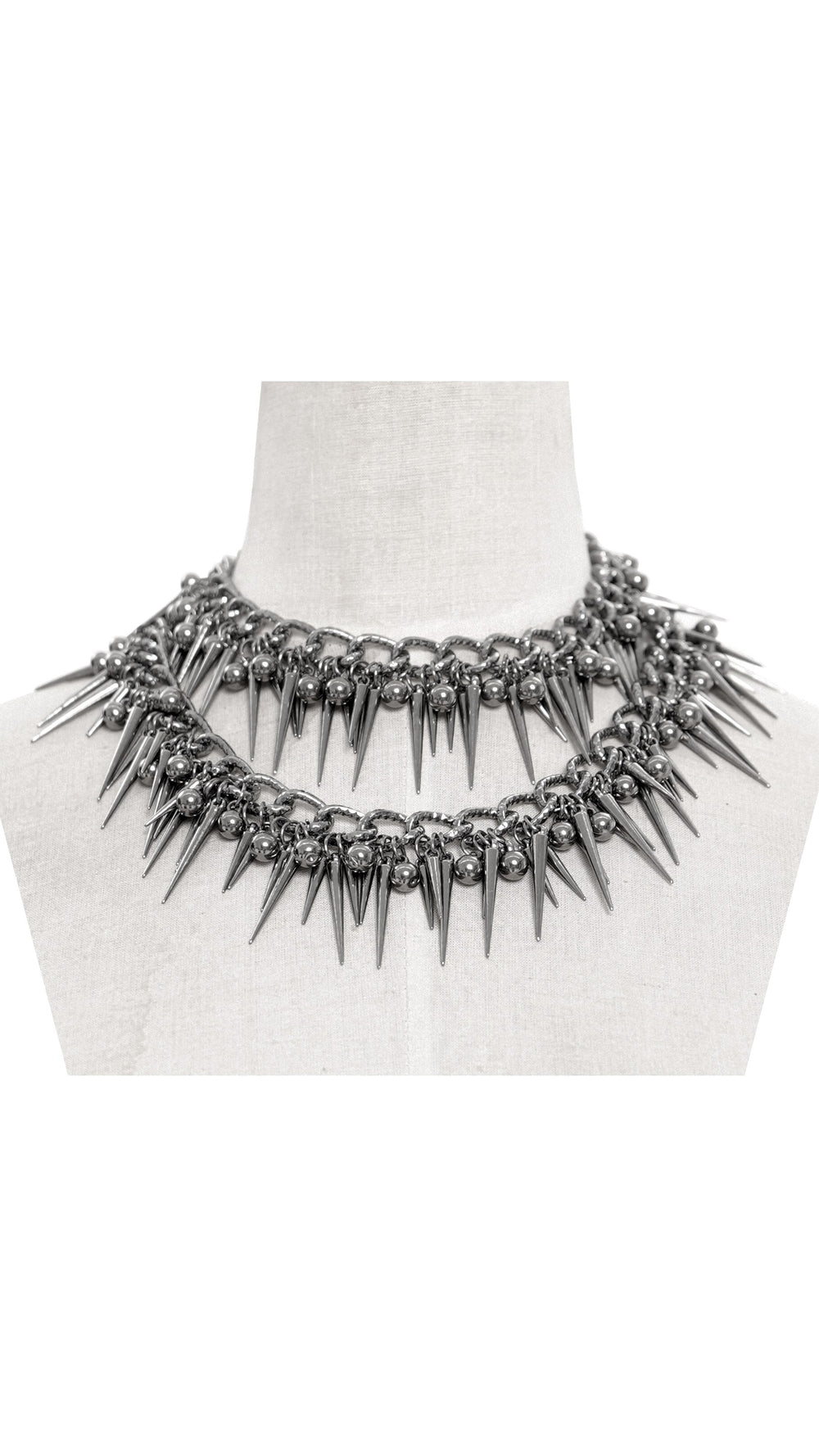Double-layer Gothic spike collar necklace displayed on a mannequin, featuring sharp silver spikes and thick chain detailing.