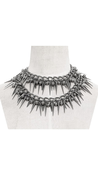 Double-layer Gothic spike collar necklace displayed on a mannequin, featuring sharp silver spikes and thick chain detailing.