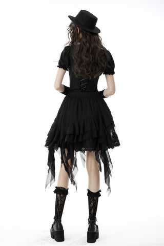Back view of model wearing the Eleanor black Gothic blouse with puff sleeves, layered skirt, hat, and lace socks on a white background