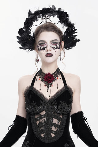 Black feather gothic headband with rose details and hanging cross worn by model