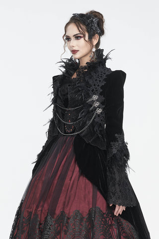 Side view of model wearing Eva Lady ECT015 black velvet bolero jacket with lace, feathers, and chain details