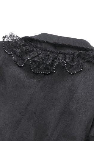 Close-up of frilled lapel with lace and beaded trim on Gothic coat