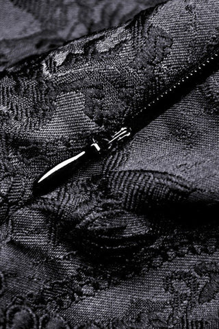 Close-up of invisible back zipper and jacquard fabric texture on black Victorian Gothic dress