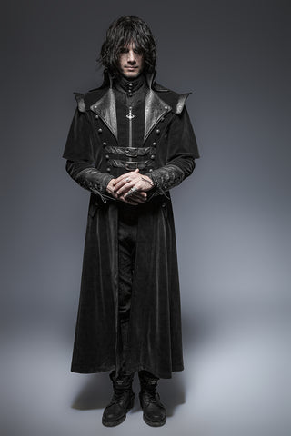 Man wearing a long black Gothic coat with faux leather lapels, double buckle chest straps, and high collar — punk rave vampire-inspired design.