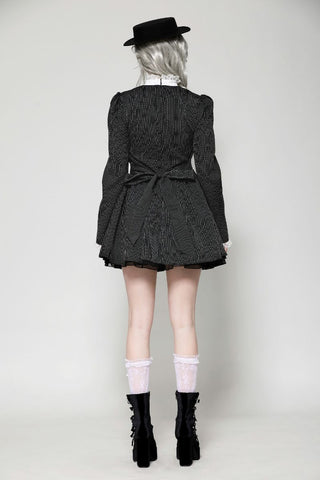 Back of the Gothic doll-inspired dress worn by model