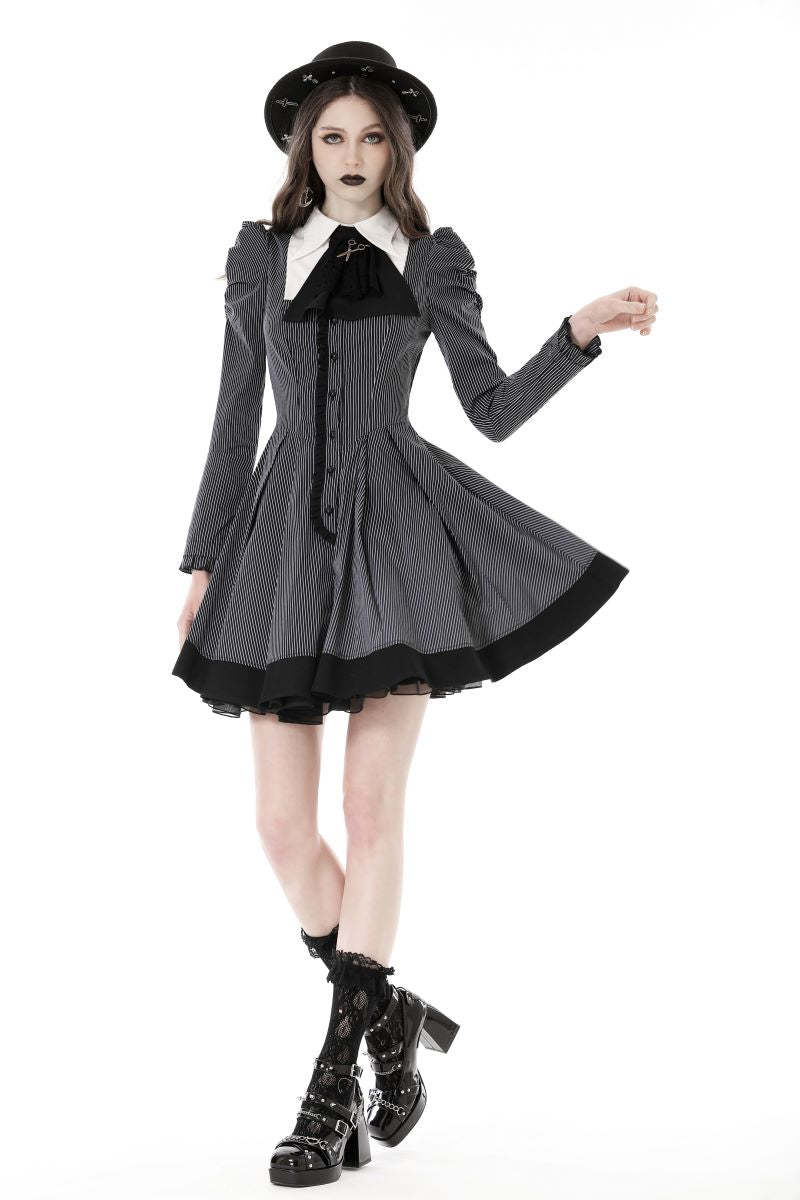 Model walking in Victorian-style striped skater dress