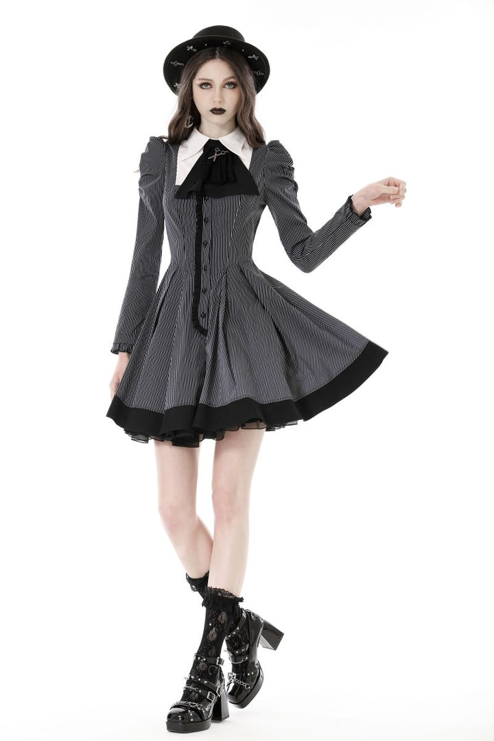 Model walking in Victorian-style striped skater dress