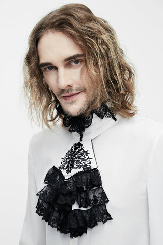 Close-up of man wearing Gothic Victorian white shirt with black lace jabot and embroidered neck detail