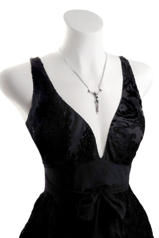 Lost Soul pewter skeleton necklace worn with a black Gothic dress