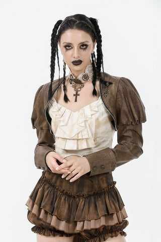 Model in a brown Steampunk aircaptain crop jacket, cream ruffled blouse, and layered bustle skirt, standing against a white background.