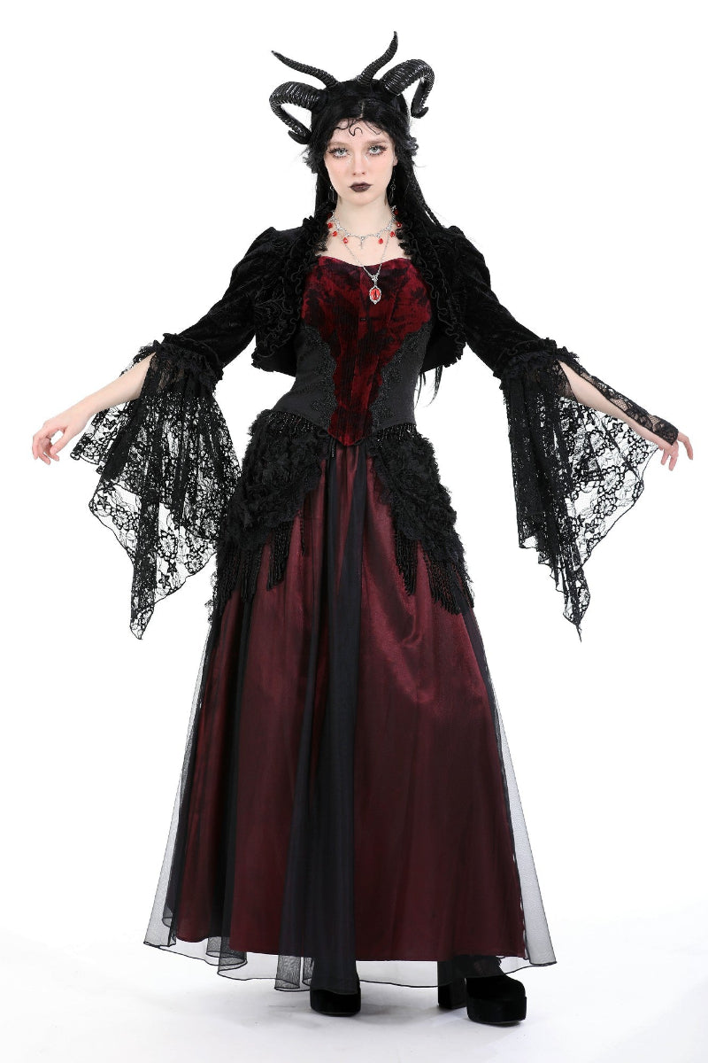 Model posing with arms out to show flared lace sleeves of the Mooncaller shrug, styled over a red Gothic dress and corset