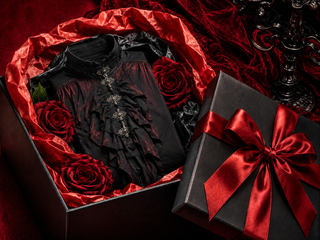 Black and red gothic shirt presented in a gift box with red roses, tissue paper and a satin ribbon.