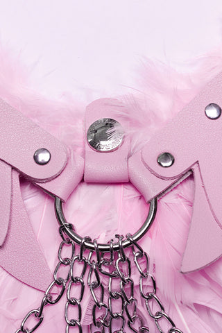 pink harness on wings