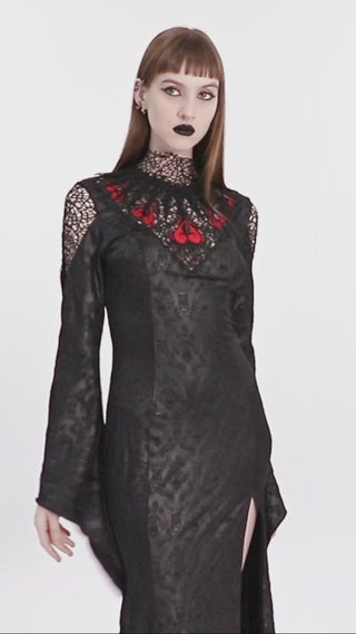 Model showcasing the Punk Rave Queen of Hearts Ball Gown with red heart embroidery, lace high neckline, long sleeves, and side slit, filmed against a white background.