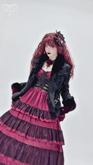 Devil Fashion AS212 Batlace Rosette hair clip shown in detail, highlighting its bat-wing lace shape, red satin center, black roses, and silver bat charm with jewel accent.
