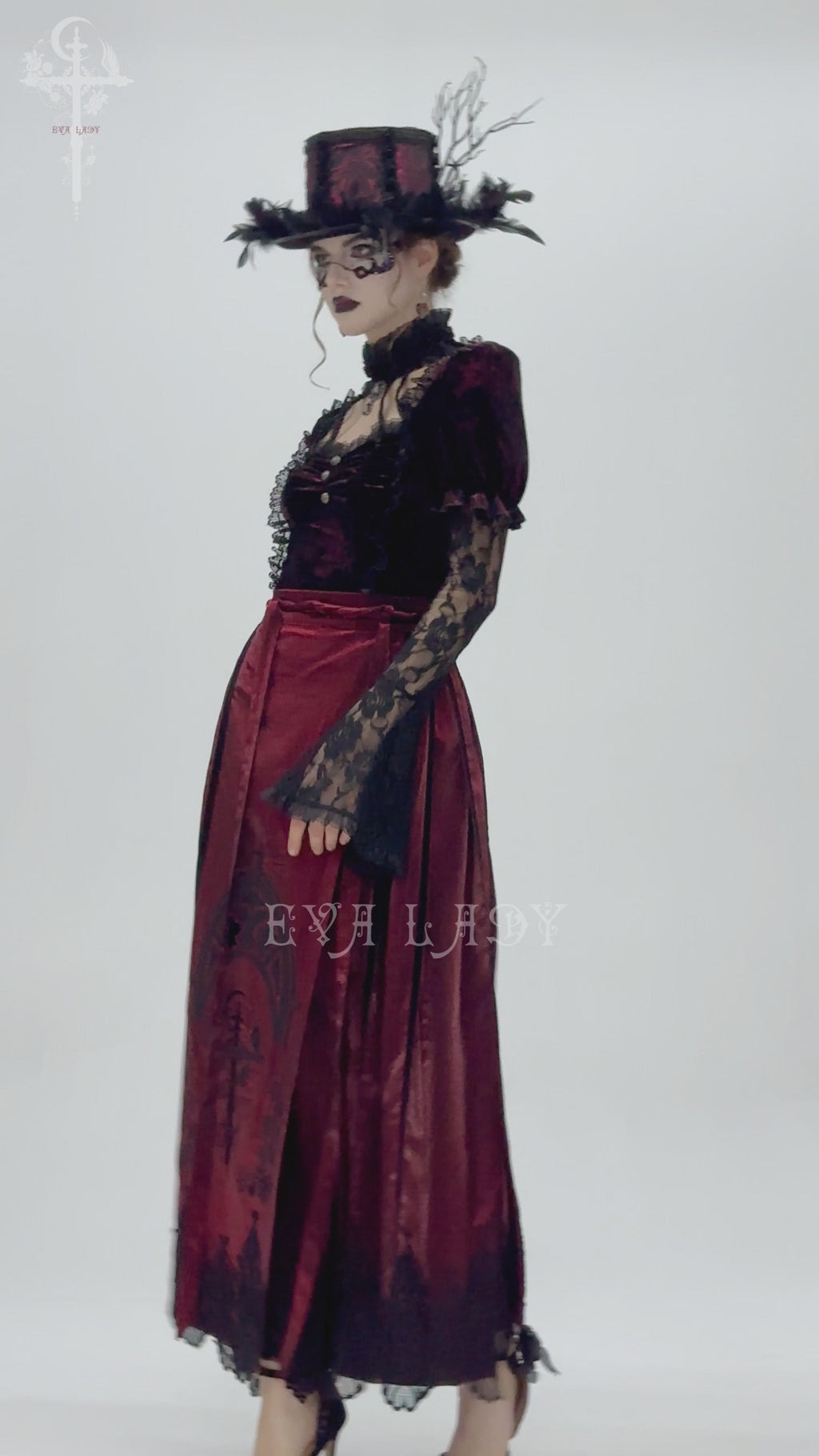 Video showing a model wearing eva lady eskt069 a maroon satin long skirt with black lace hem and embroidered details, turning to display the front, side, and back views.