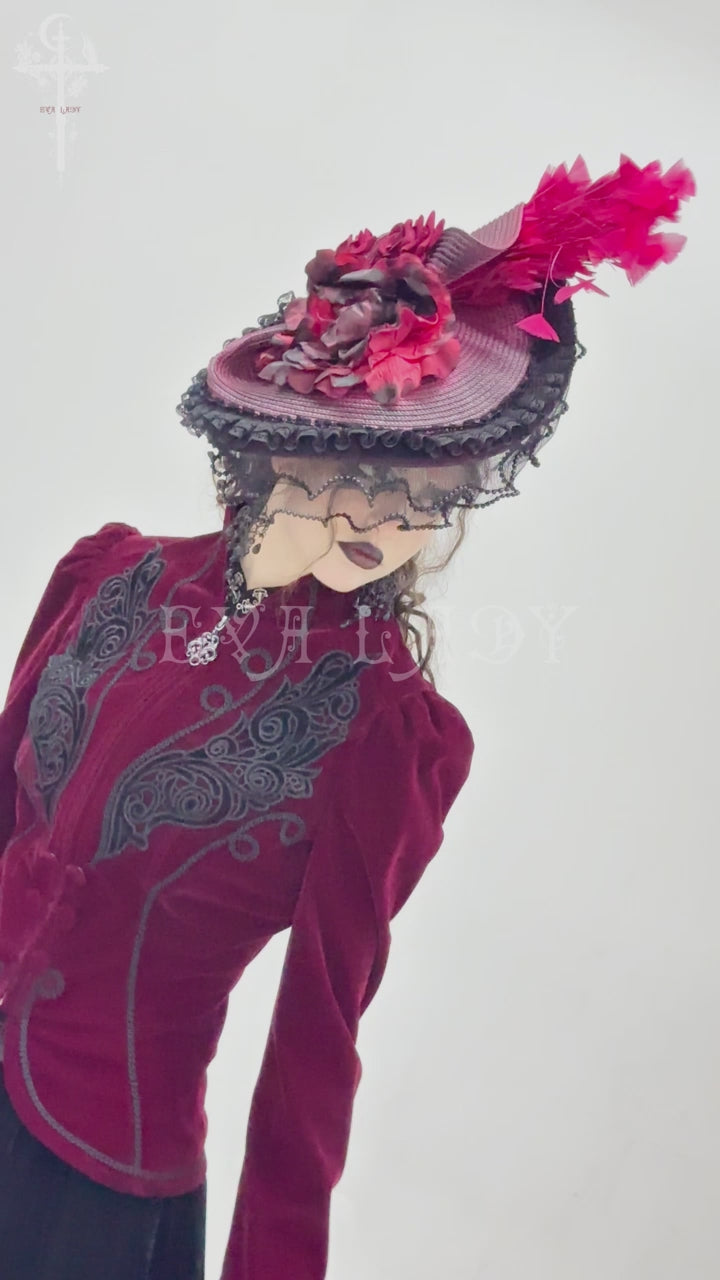 Model wearing eva lady eas02402 a crimson Victorian hat with black lace and red feathers, slowly turning to show detail from different angles. Paired with a matching red velvet Gothic jacket.