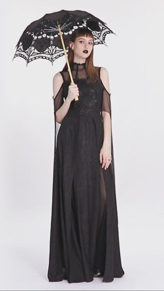 Video of model holding and displaying the ‘punk rave ws0549’ Victorian cotton lace parasol, rotating to show full lace canopy and carved handle details