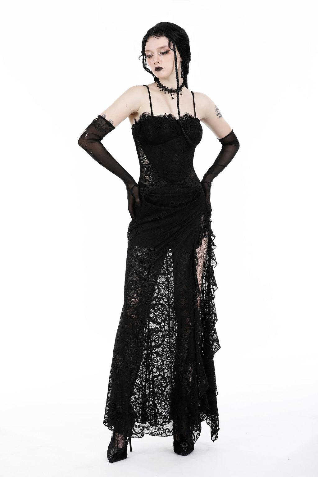 video of model wearing black sheer lace maxi dress with strapless sweetheart neckline, fitted bodice, high side slit, and floral lace overlay, styled with gothic accessories.