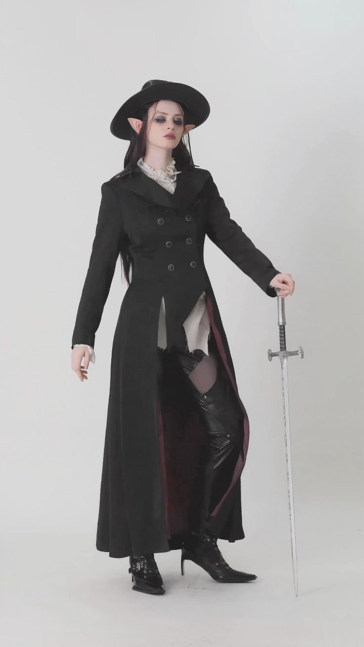 Model showcasing long black vampire coat with high collar and dramatic silhouette in motion
