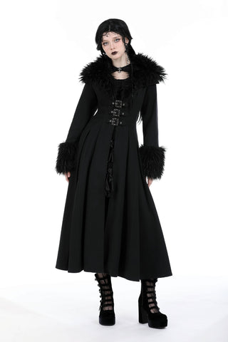 Woman modelling a black Romantic Gothic maxi coat with faux fur collar and cuffs, front buckle closures, fitted waist, and flowing skirt.