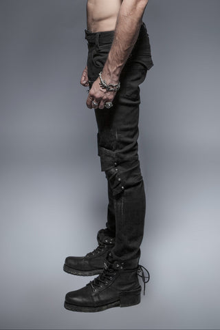 Side view of Punk Rave K-239 men’s black slim-fit pants with zipper accents, panel detailing, and strap embellishments, paired with black combat boots against a grey background.