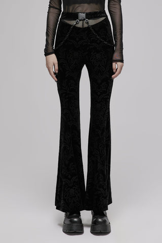 Model wearing Punk Rave OPK-476 black velvet Gothic flare pants with buckle belt and chain detail by Punk Rave, against light grey background.
