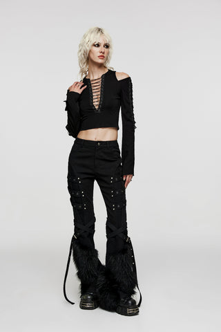 Full-body view of model wearing black cropped top and Punk Rave flared pants with faux fur trim and strap details, standing against a white background.