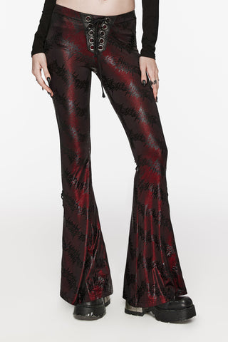 Close-up of Punk Rave WK-619 Gothic red flared trousers with black abstract pattern and lace-up waist detail.