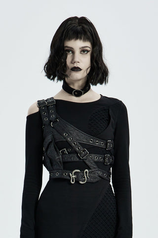 Woman wearing Punk Rave black one-shoulder post-apocalyptic harness with adjustable straps, eyelet detailing, and snake buckle, styled over a fitted black outfit.