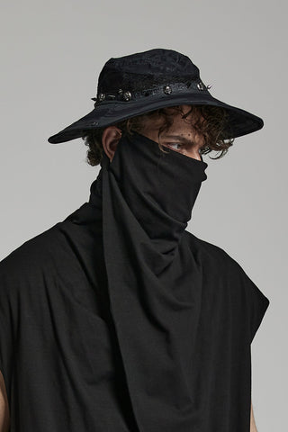 black wide brim distressed hat with skull and spike band worn with dark outfit