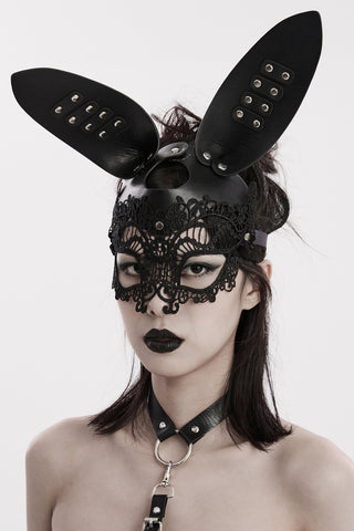 Woman wearing a Gothic black faux leather bunny mask with rivet details and lace eye covering, styled against a white background.