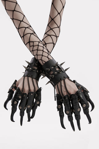 Punk Rave WS-595 Pantherchain Claws – black faux leather wrist cuffs with spiked studs, chain-linked reptile-embossed finger claws, worn with fishnet sleeves on white background.