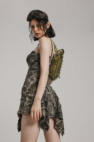 Woman wearing a distressed gothic dress and carrying a spiked olive-green crossbody bag (punk rave ws-627) on her back.