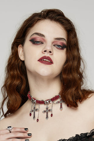 Model wearing Romantic Gothic red velvet choker with silver curb chain, hanging chains, and ornate silver cross pendants accented with red beads.