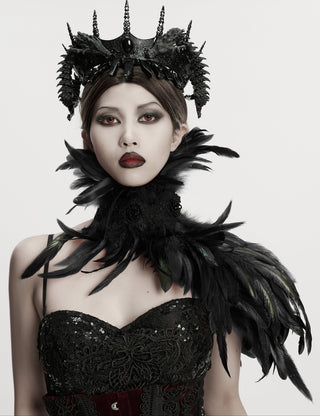 Model wearing a black Gothic feather shawl with high collar and asymmetrical shoulder design against a plain background