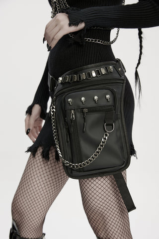 Punk Rave WS-868 women’s Gothic waist–leg bag with skull studs and chain detail, styled with a black dress and fishnet tights.