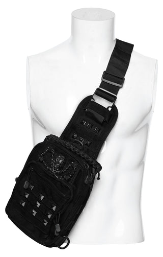 Black cyber goth utility sling bag with skull hardware, stud details and adjustable crossbody strap on white background