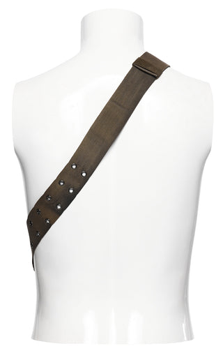 Adjustable brown crossbody strap with metal eyelet details on white mannequin display