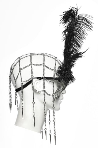 Silver rhinestone spider web masquerade mask with black feather and hanging chains, side view
