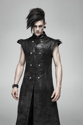 Close-up of a long black distressed coat with structured shoulders, high collar and military-style front closures worn by a model.