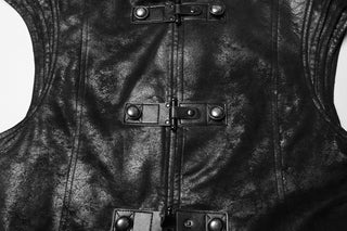 Close-up of black textured fabric with military-style snap closures and structured seam details on a long coat.