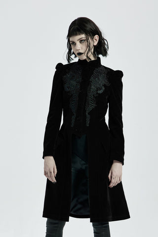Model wearing punk rave wy-1036 a long black Gothic velvet coat with ornate embroidery and corset back, styled against a white background.