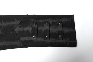 Close-up of black Gothic coat sleeve with studded strap details