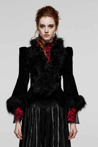 Model wearing a women's Victorian Gothic black velvet jacket punk rave wy-1513 with faux fur trim, embossed pattern, and flared sleeves over a long black skirt