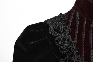 Close-up of structured black velvet shoulder with floral embroidery and burgundy panel
