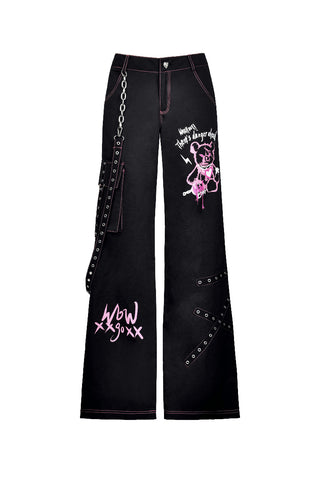 Black Y2K punk wide-leg trousers with pink teddy bear graffiti, chain, and grommet straps on white background