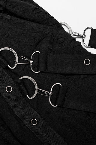 Close-up of silver D-rings and strap detailing on black Punk Rave dropcrotch pants